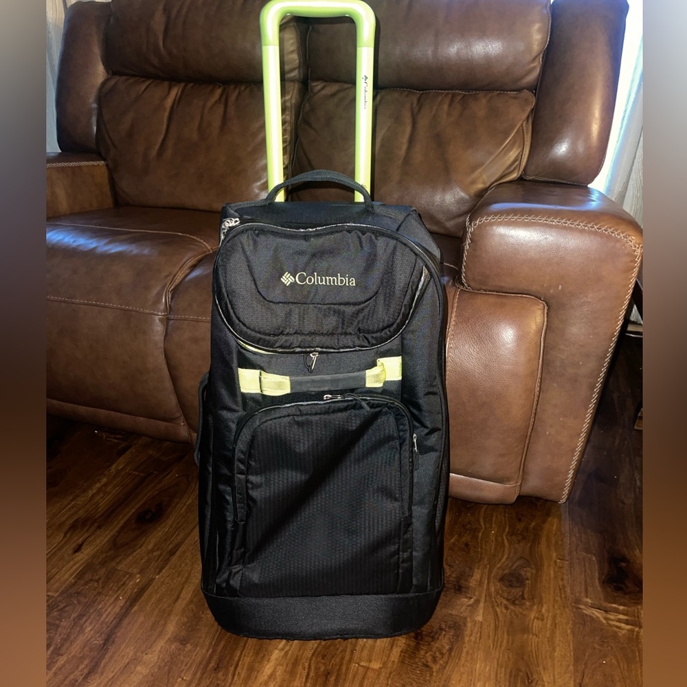 Columbia two wheel carry on luggage with minor cosmetic scratches as pictured.